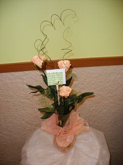 Composición de tres rosas preservadas